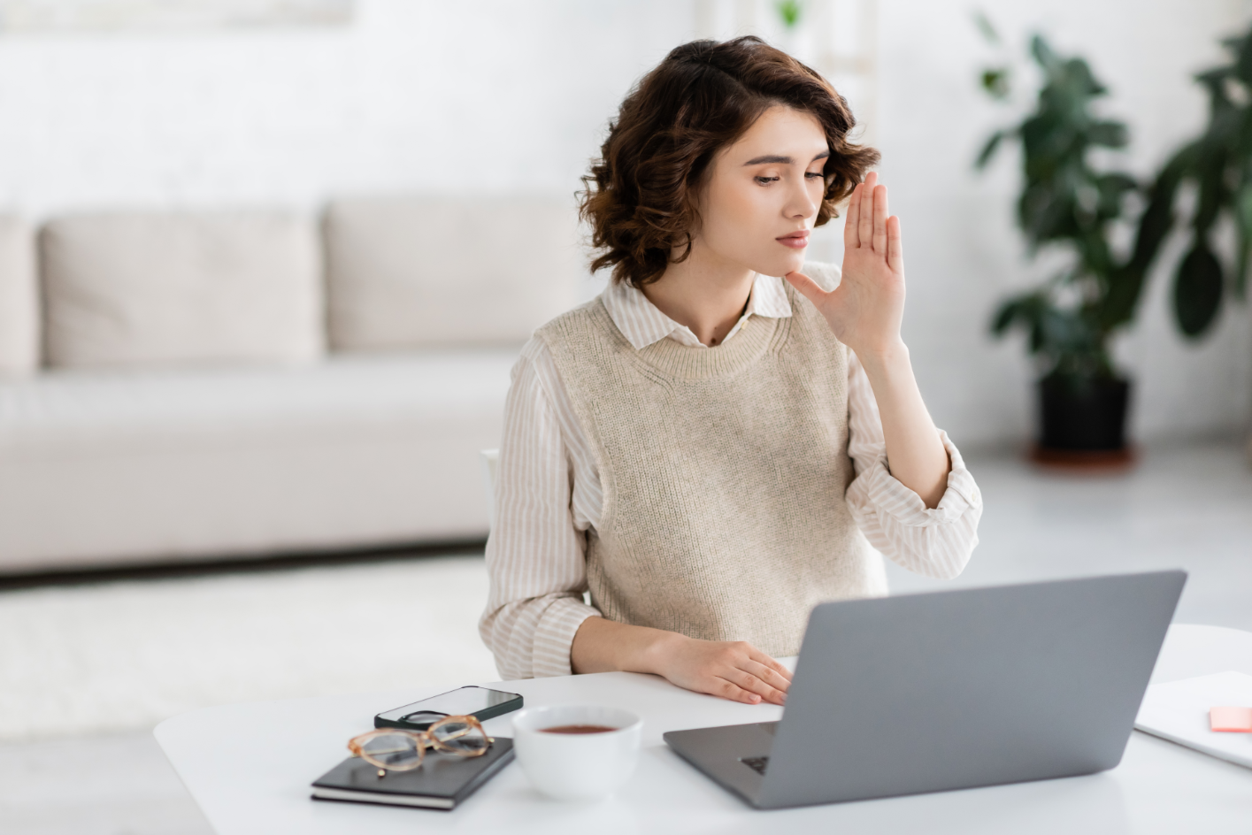 An ASL interpreter translating through a video call.