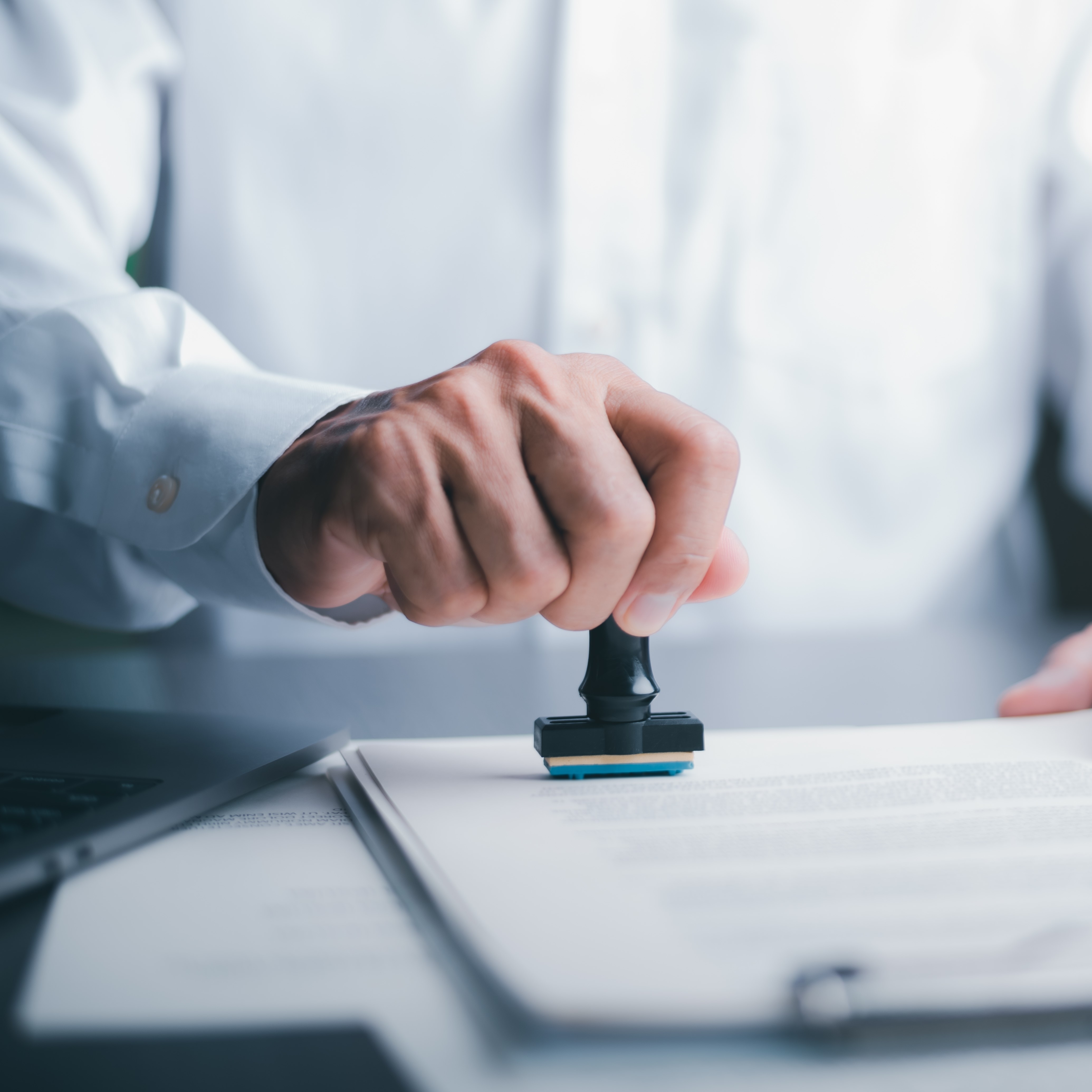 A lawyer stamping a document
