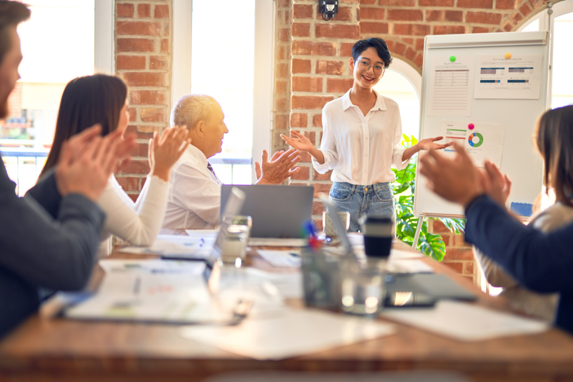 A lecture being conducted in an office.