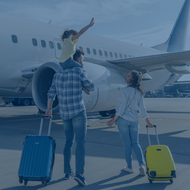 a family boarding a plane