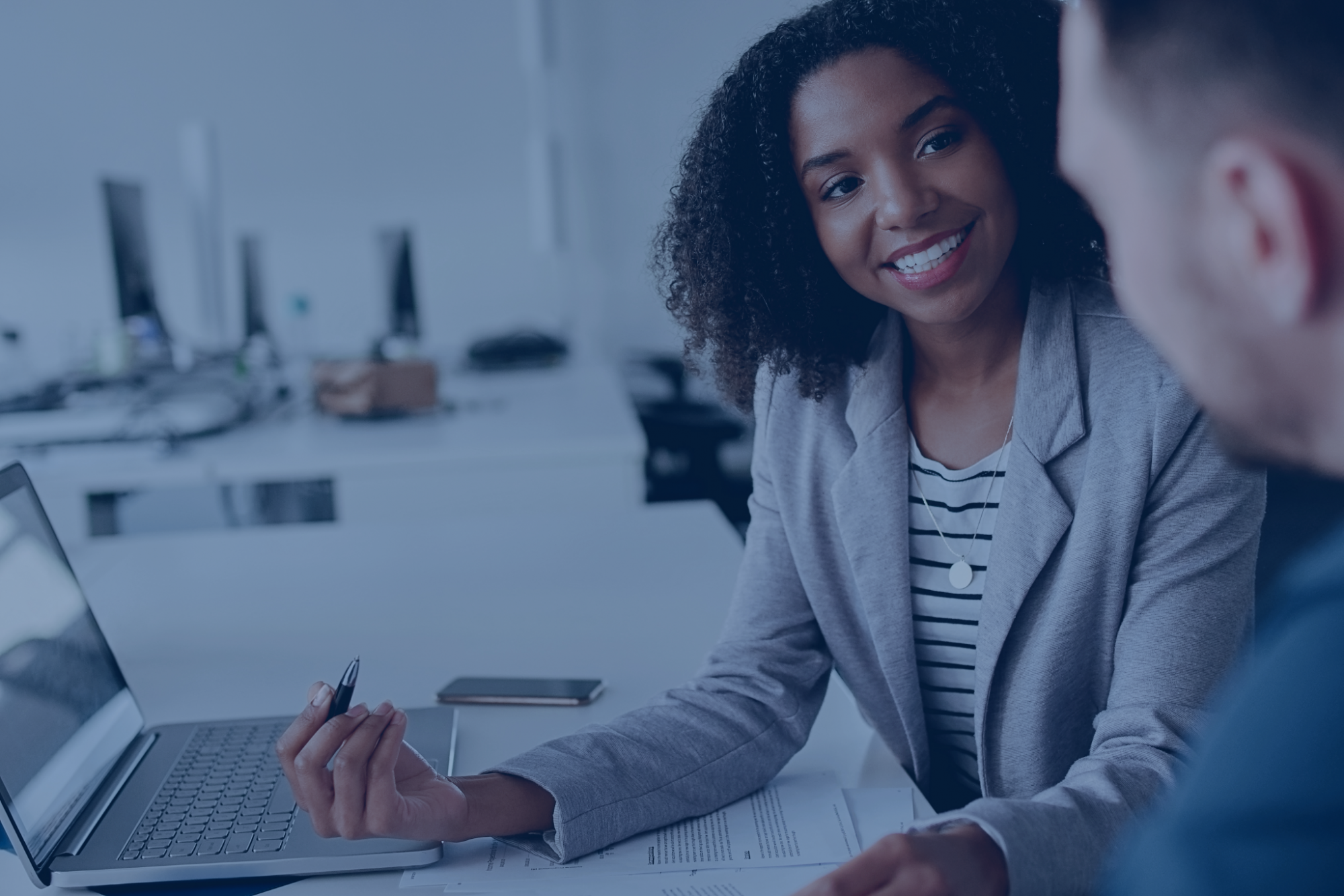 Financial adviser sitting with a customer.