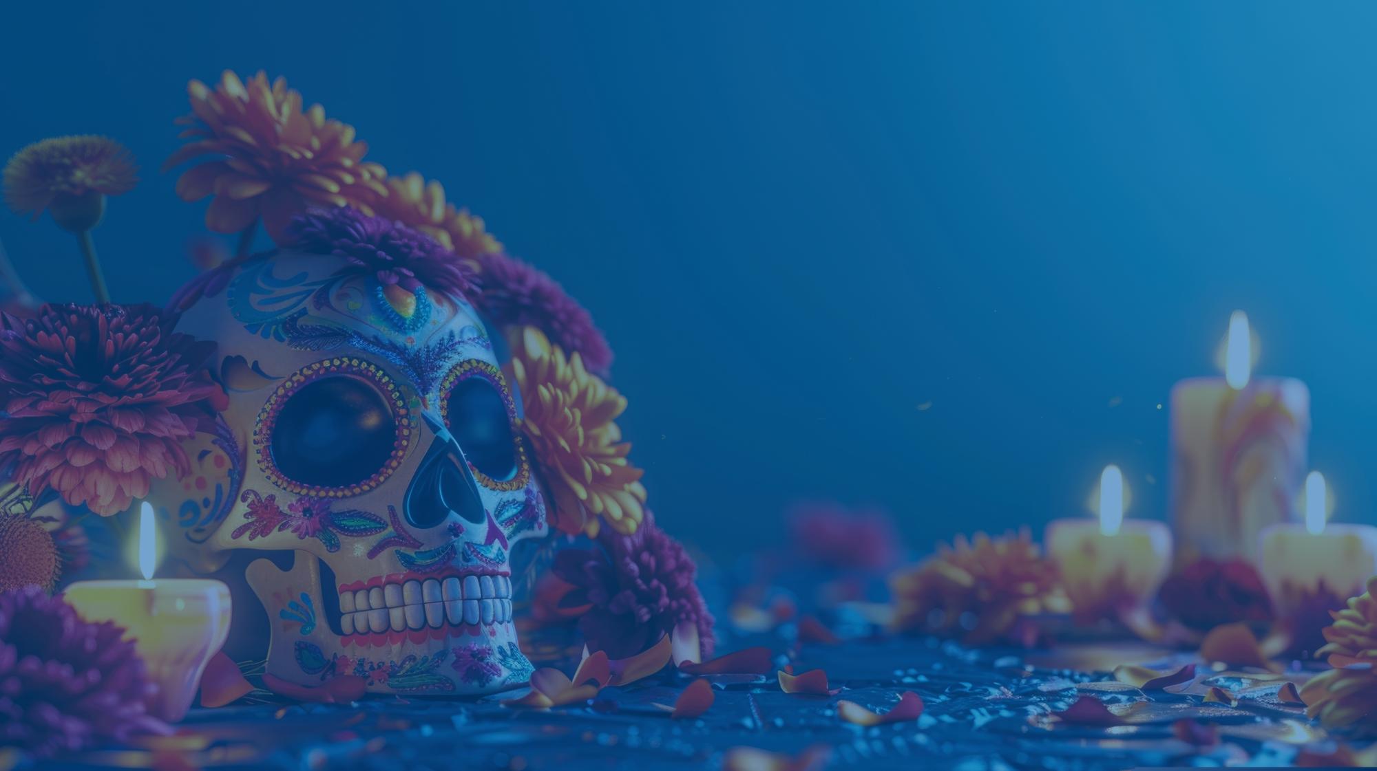 Colorfully painted skull with bight flowers and candles.