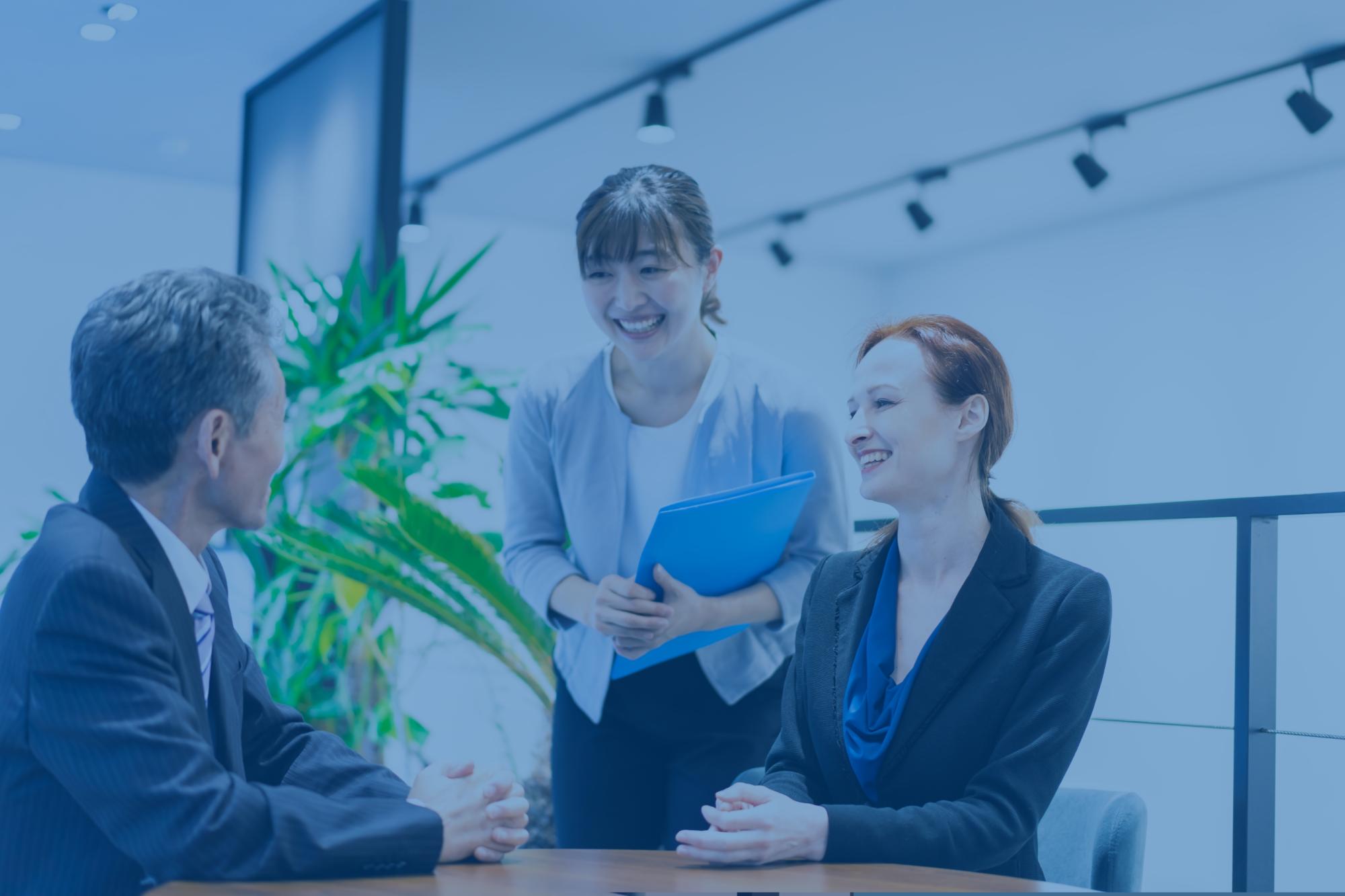 A business man consulting with his legal advisor through an interpreter.