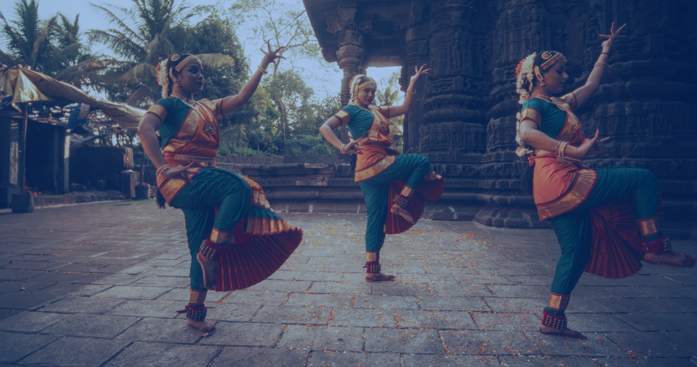 3 indian dancers performing a dance routine