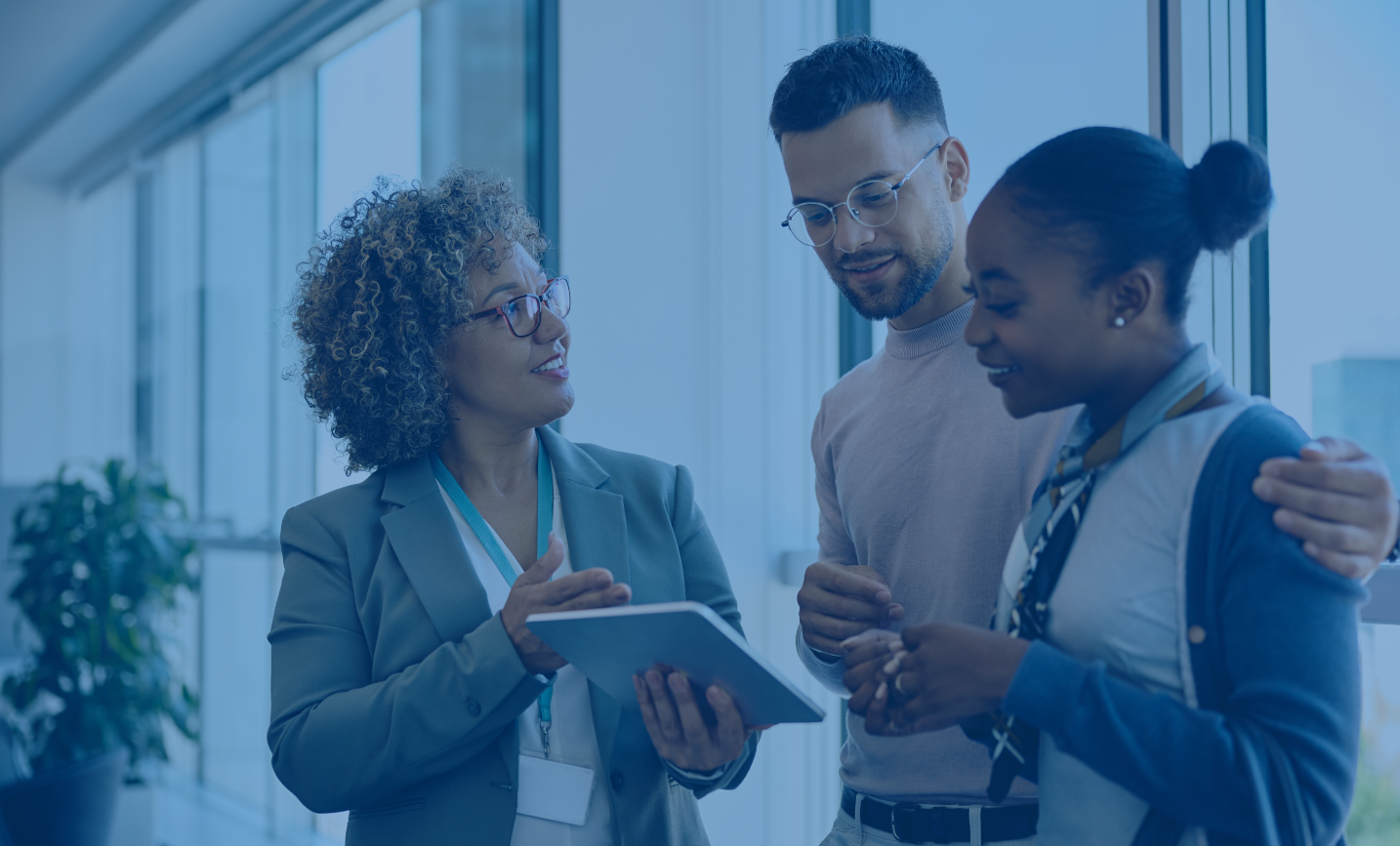 A couple consult a bank teller.