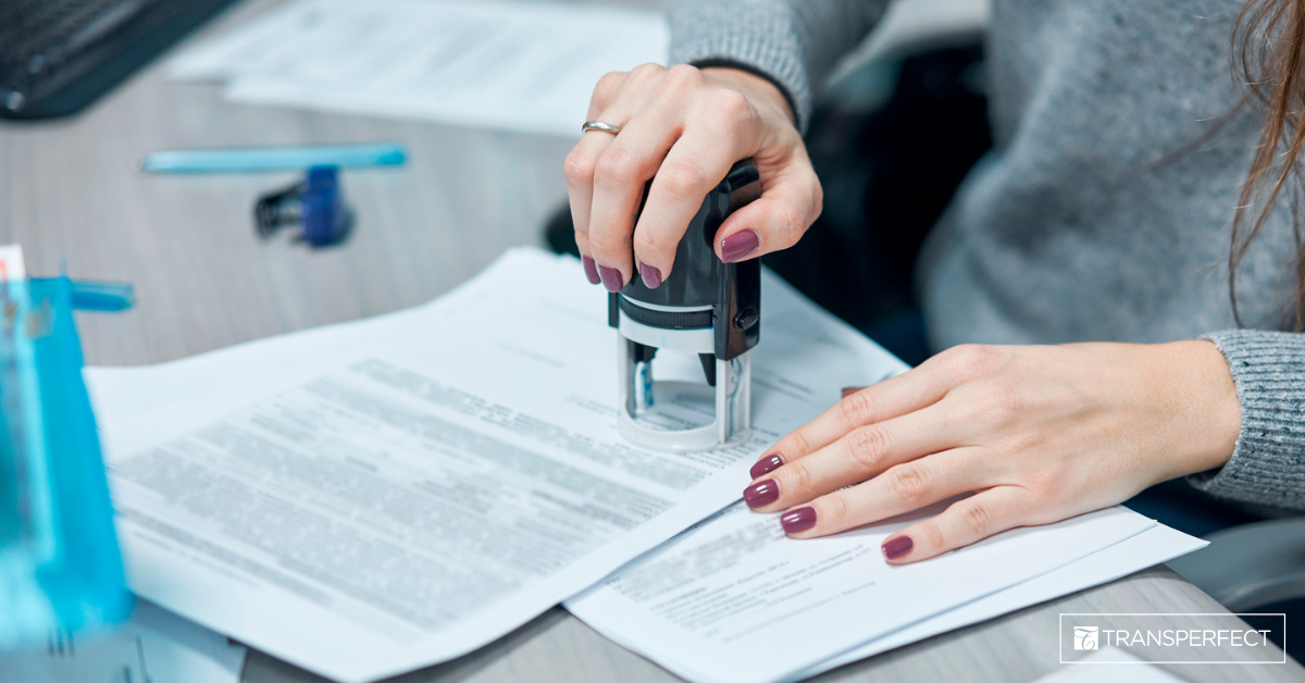 Women Stamping Documents