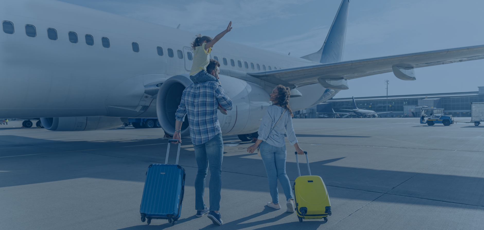 a family boarding a plane